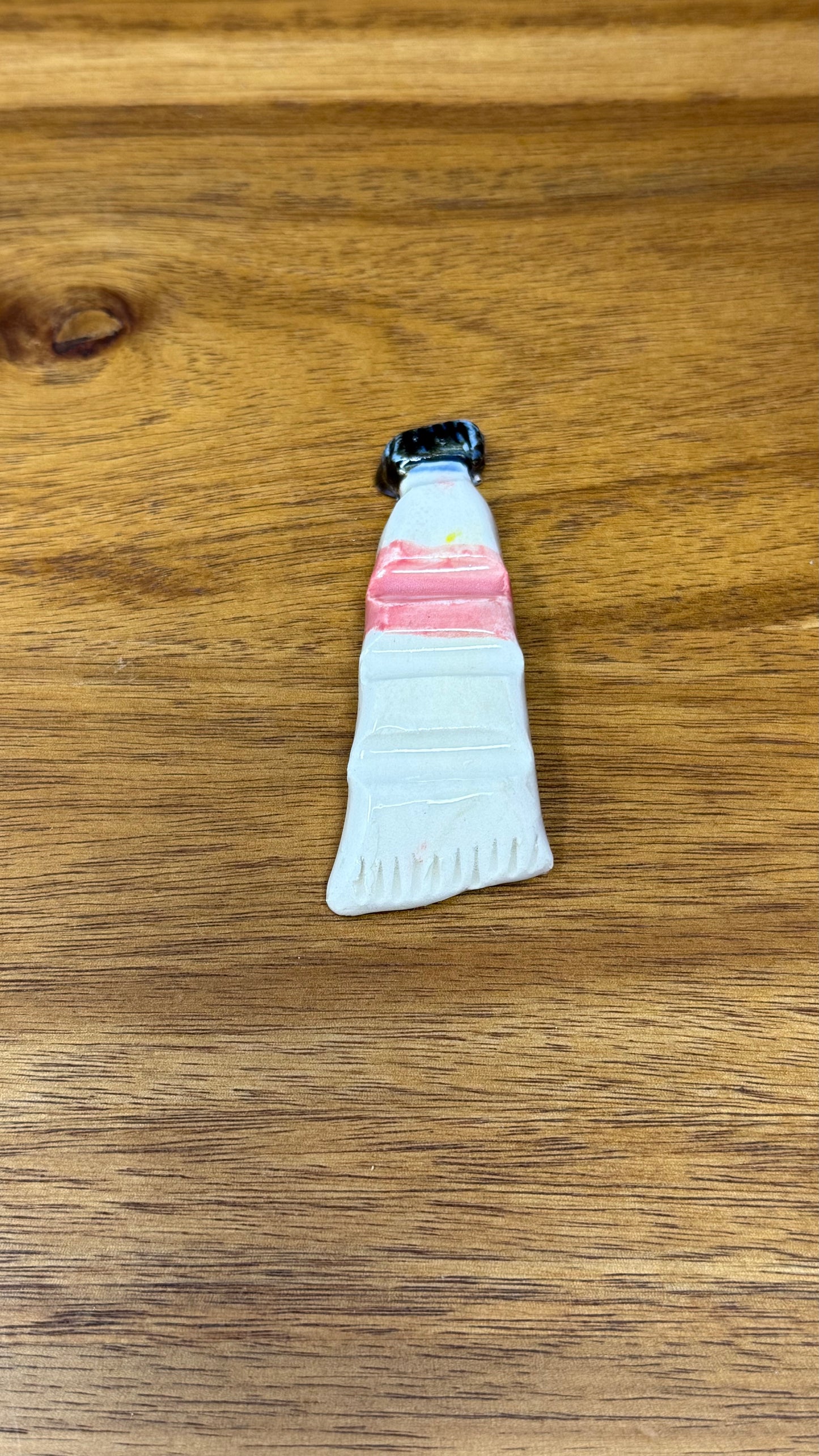 Paint tube brush rest