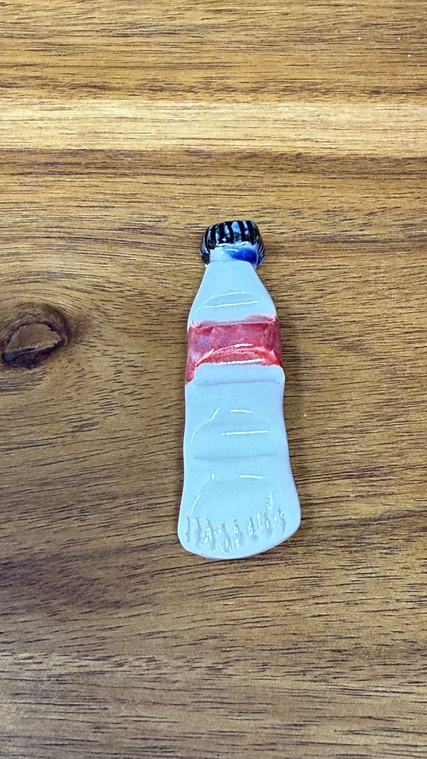 Paint tube brush rest