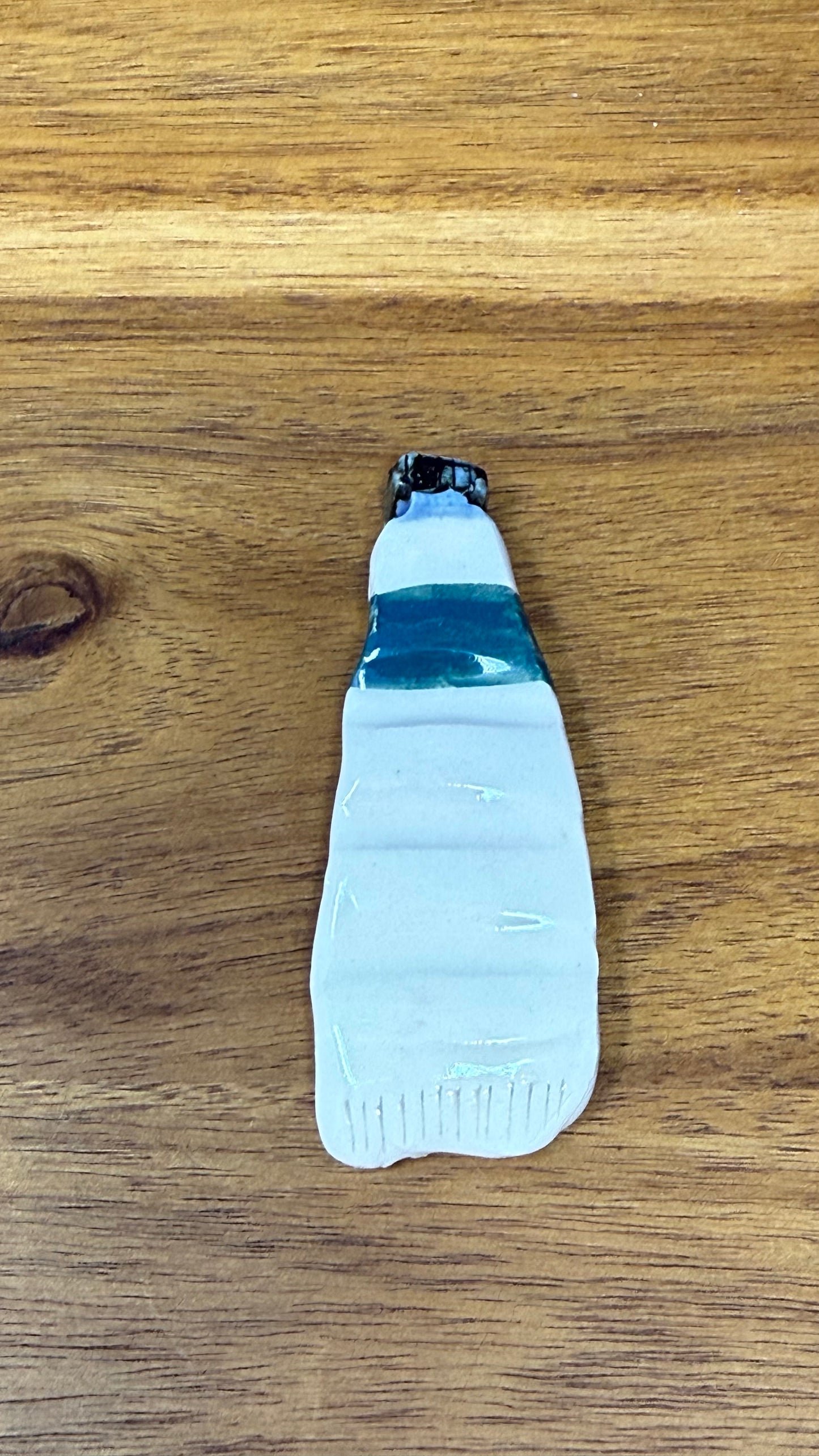 Paint tube brush rest