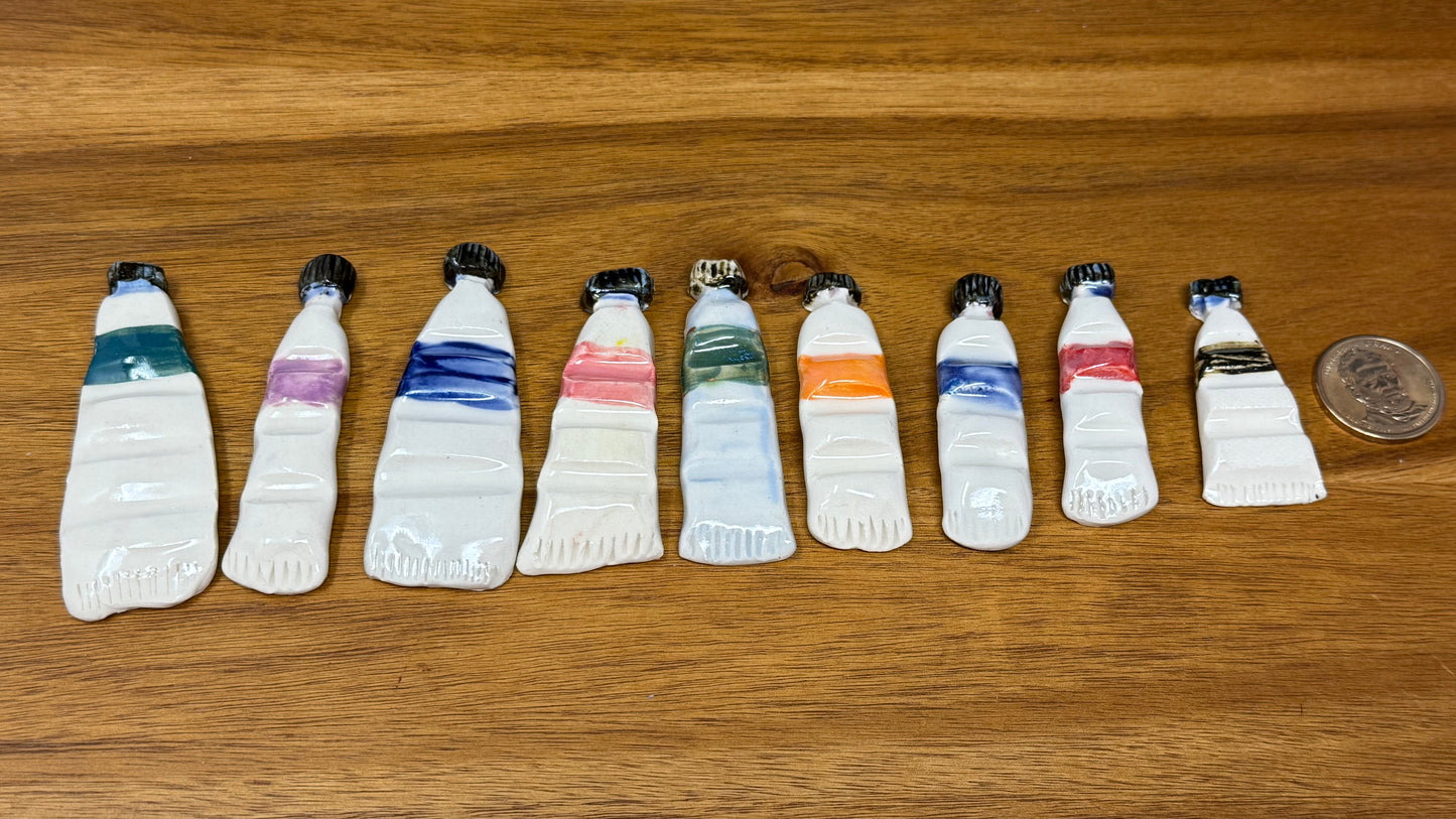 Paint tube brush rest