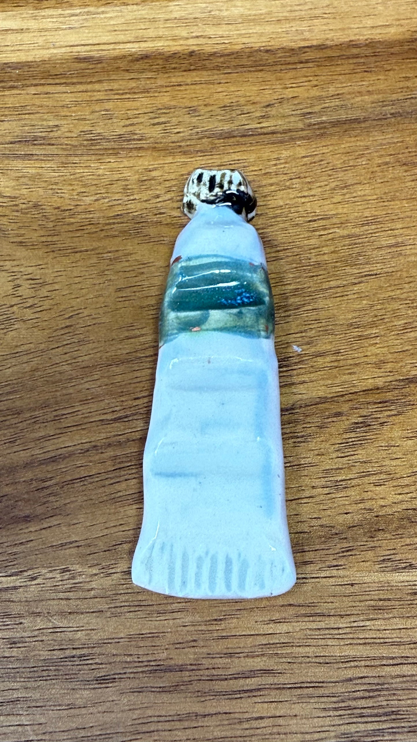 Paint tube brush rest