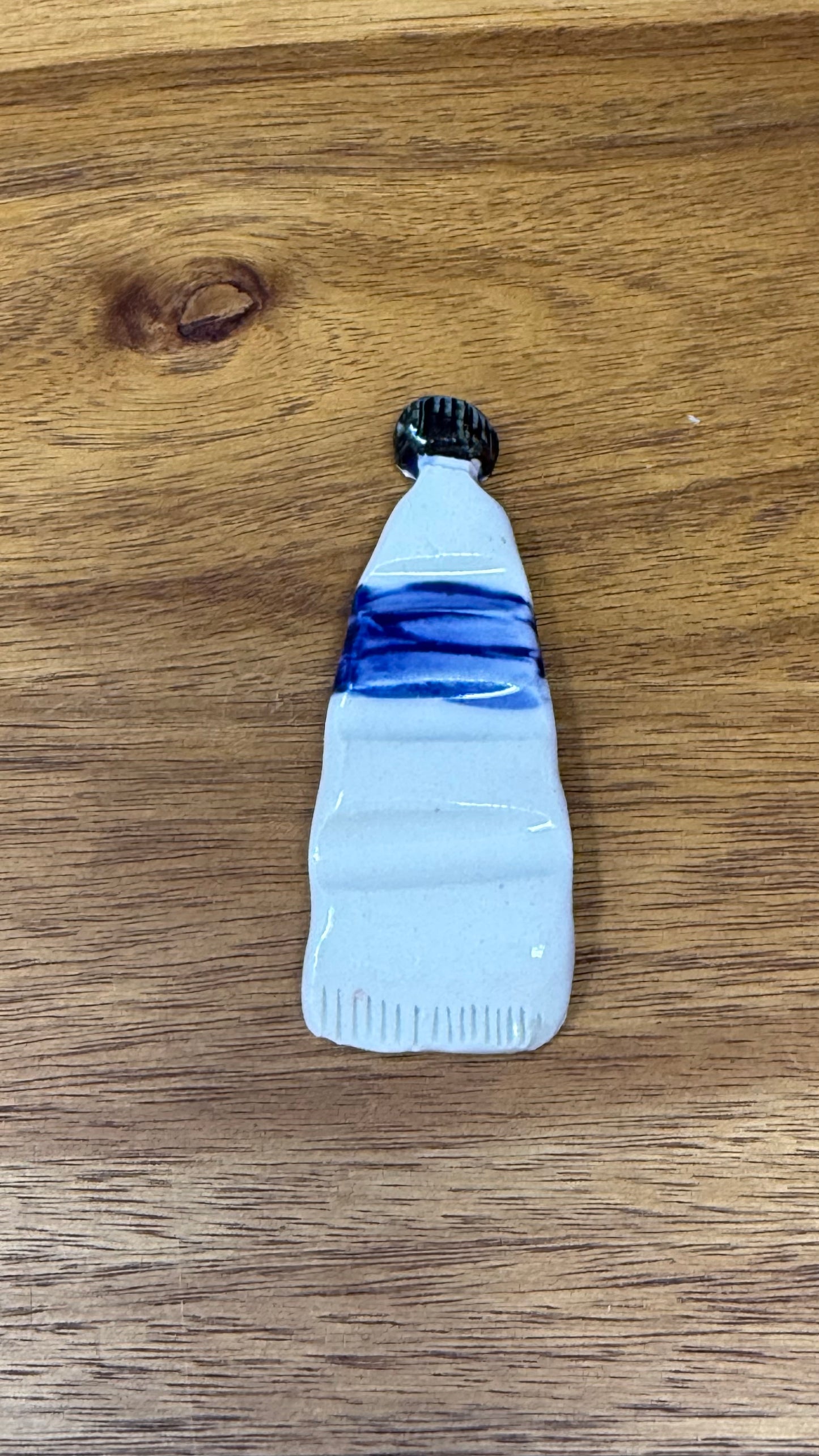 Paint tube brush rest