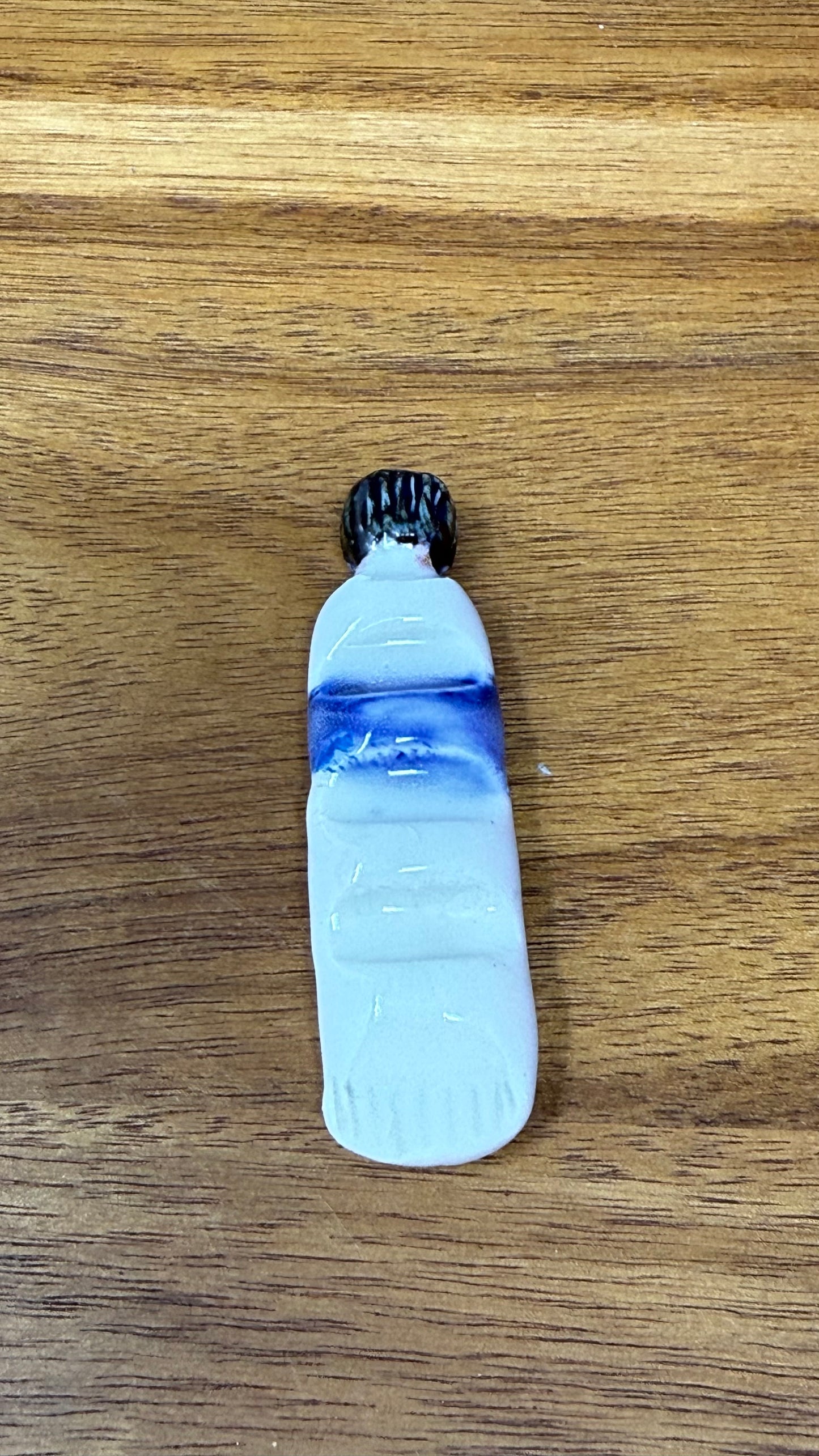 Paint tube brush rest