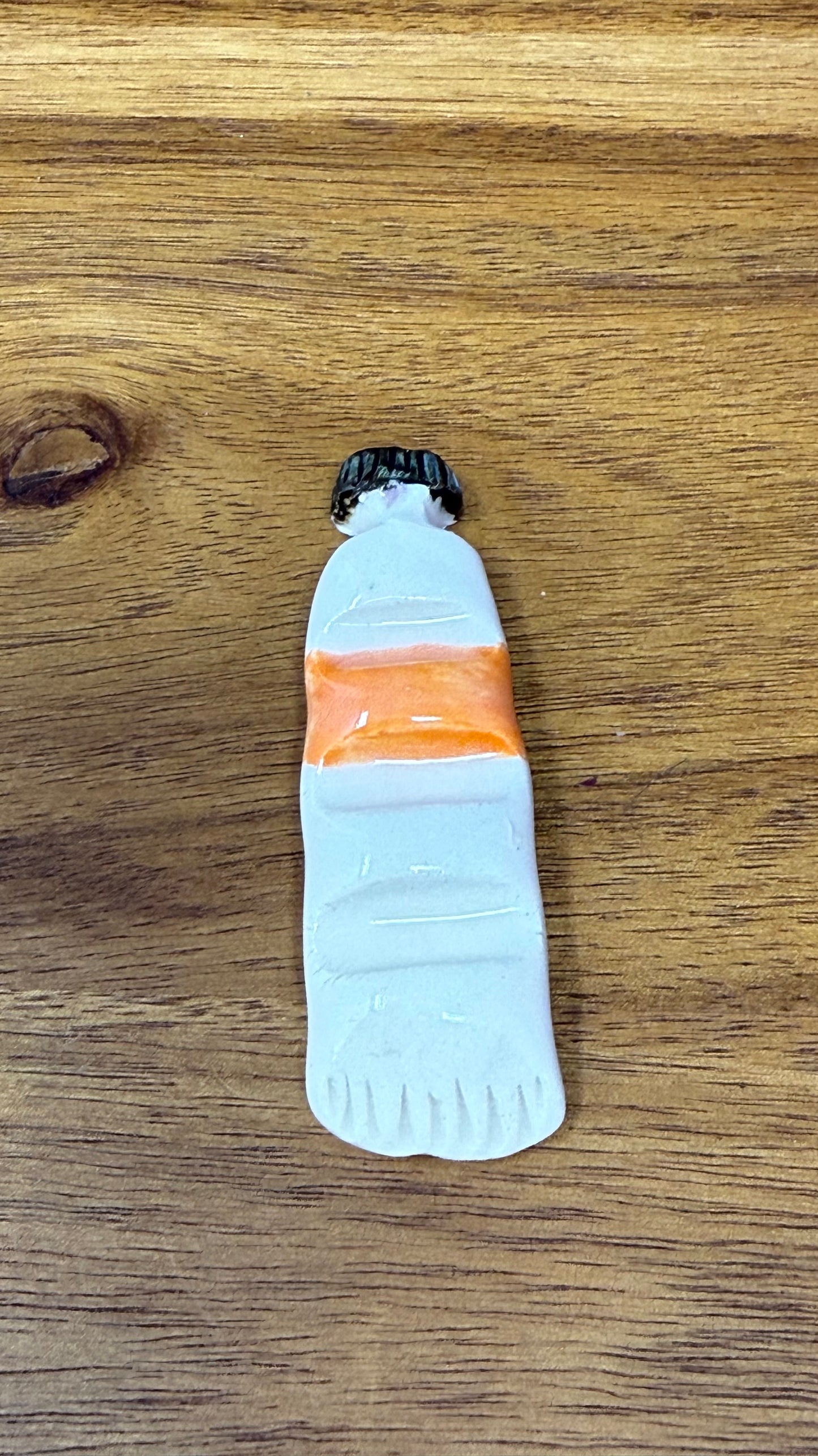 Paint tube brush rest