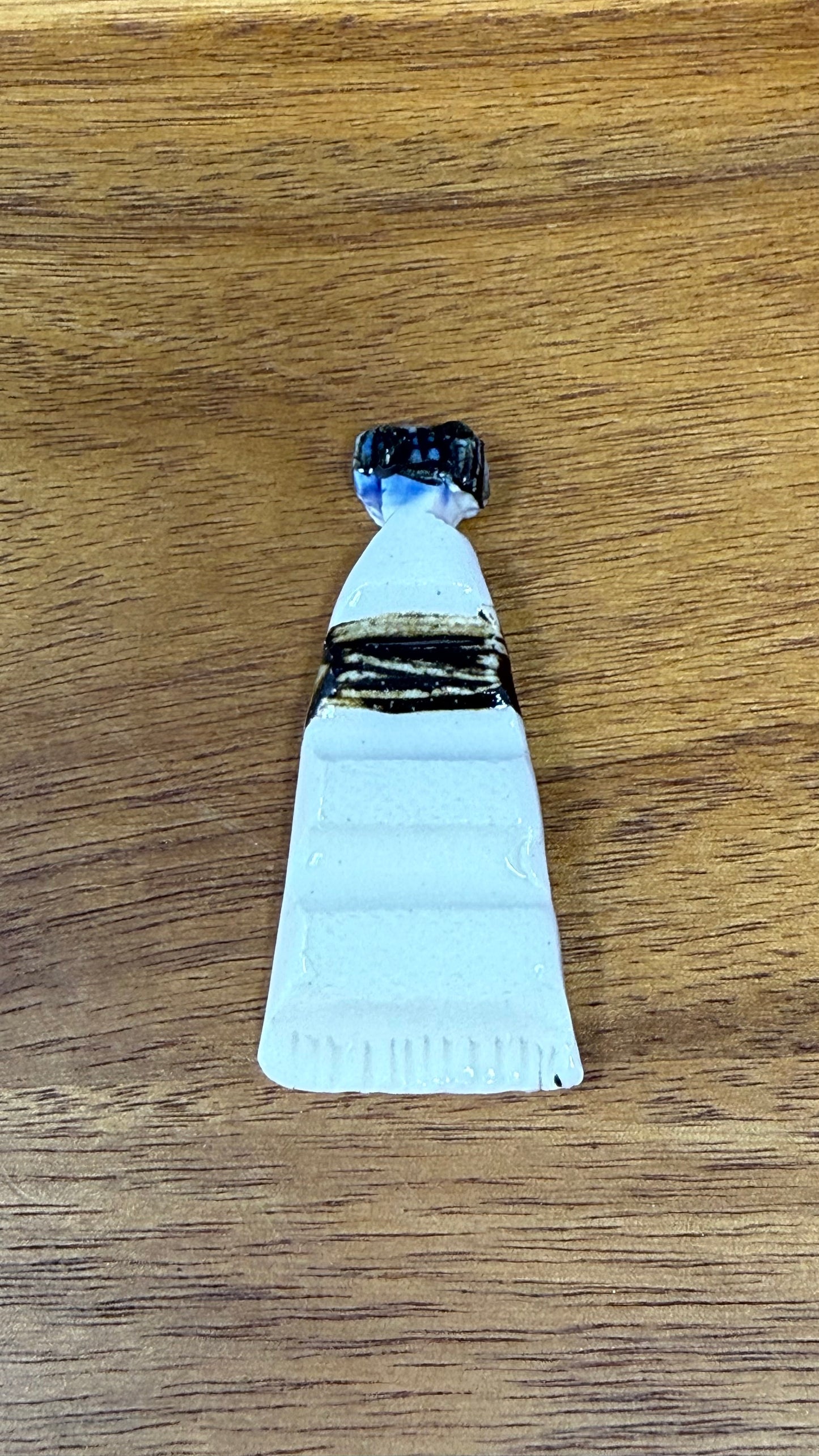 Paint tube brush rest