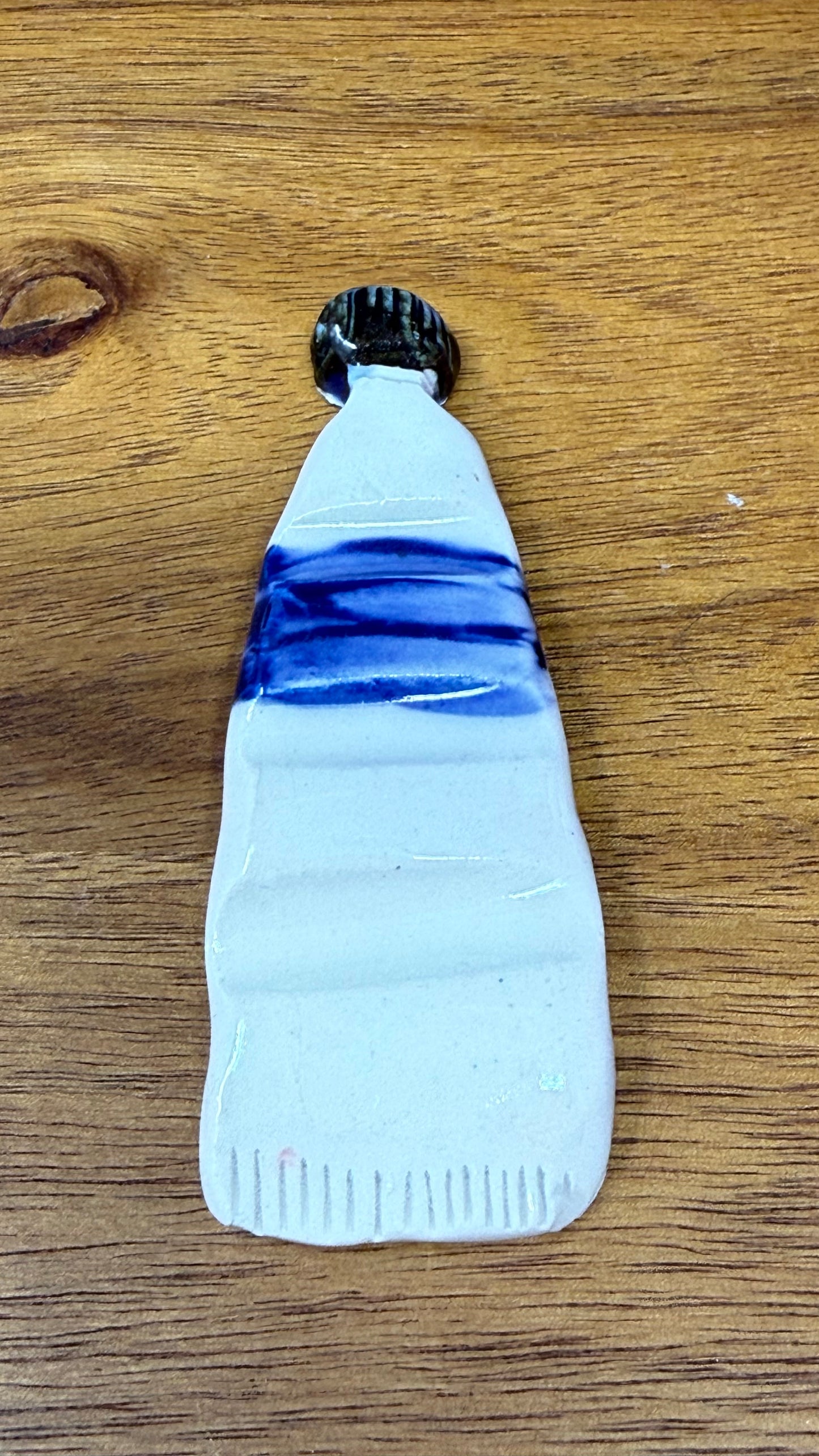 Paint tube brush rest