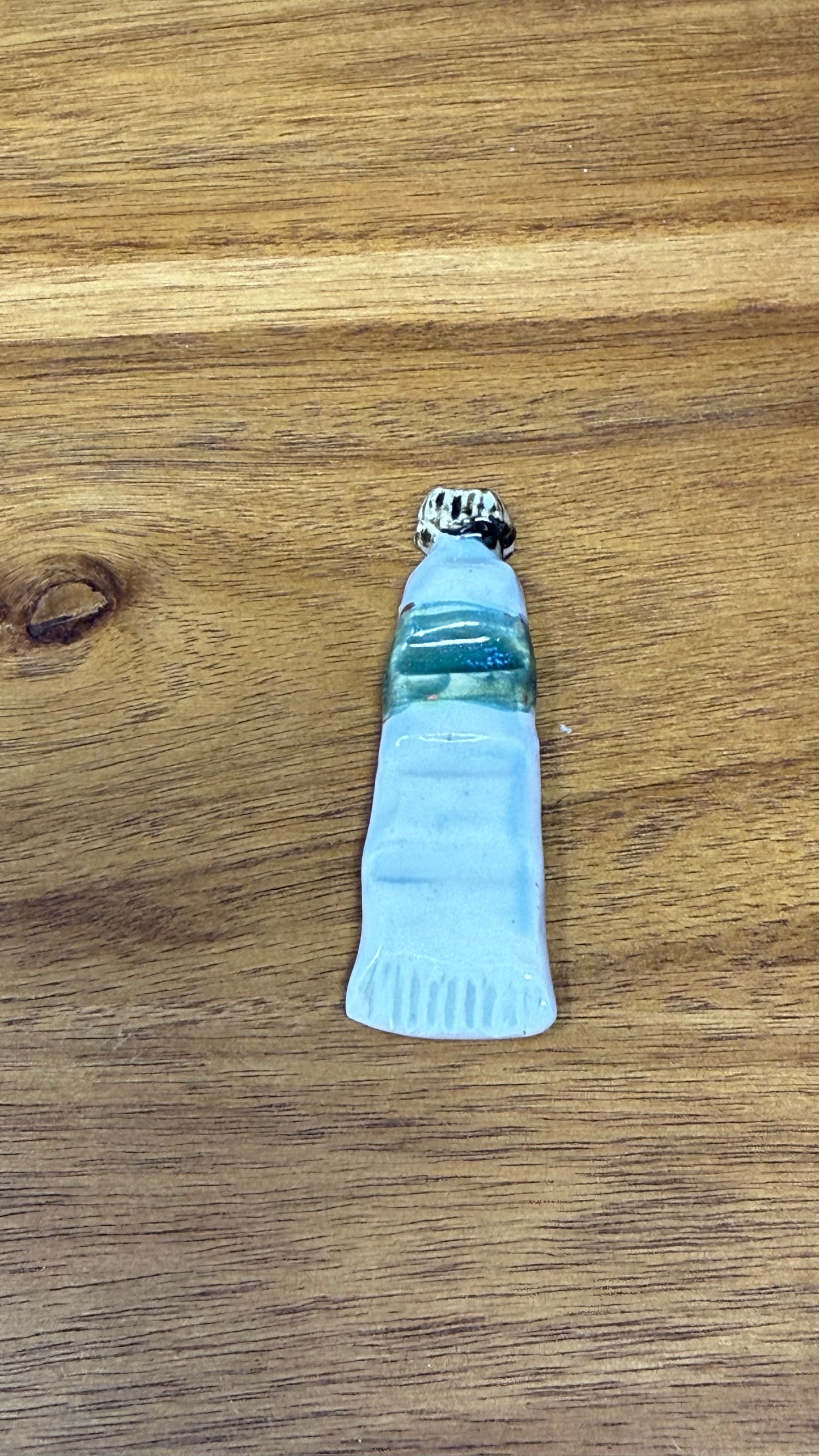 Paint tube brush rest
