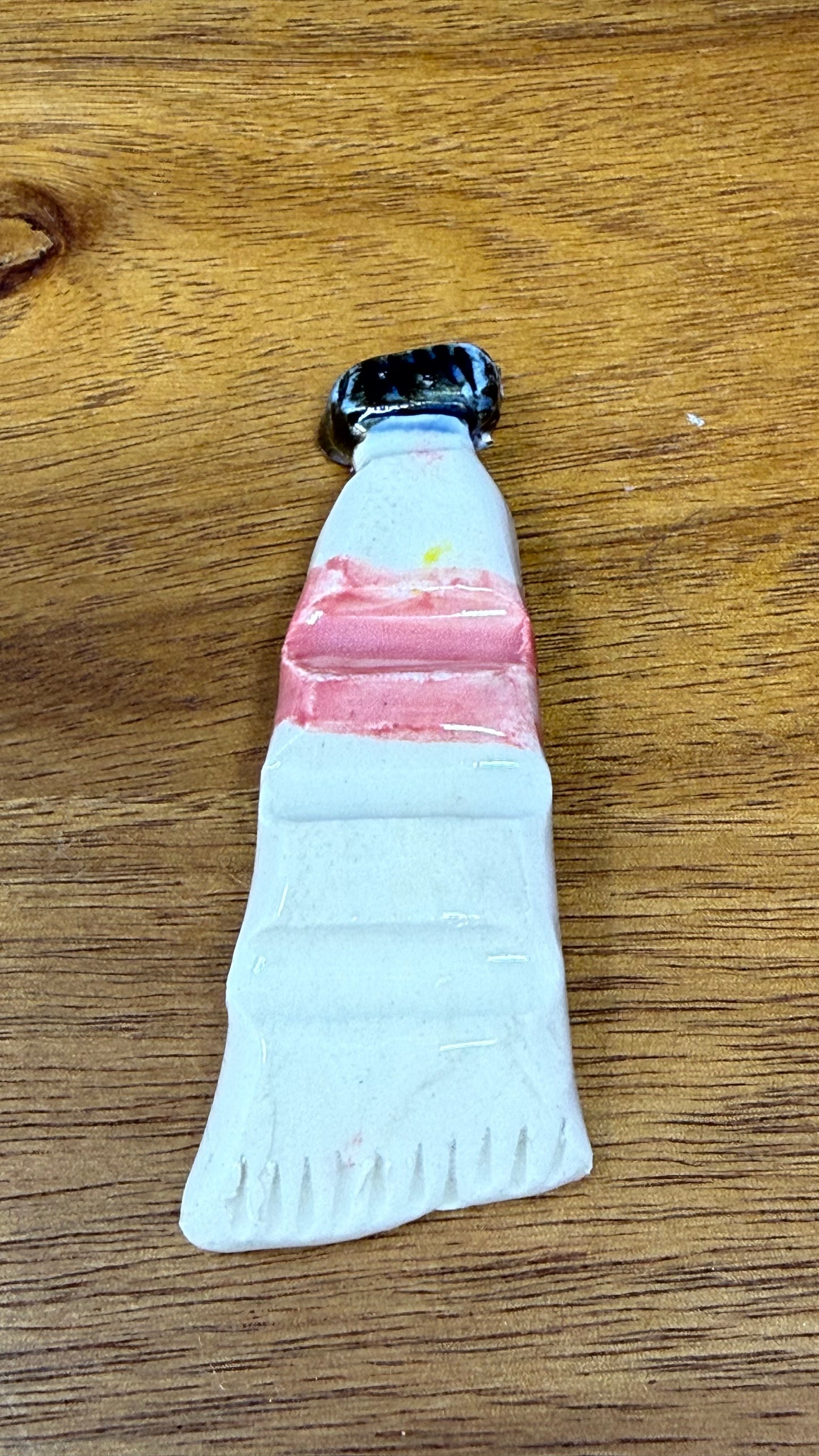 Paint tube brush rest